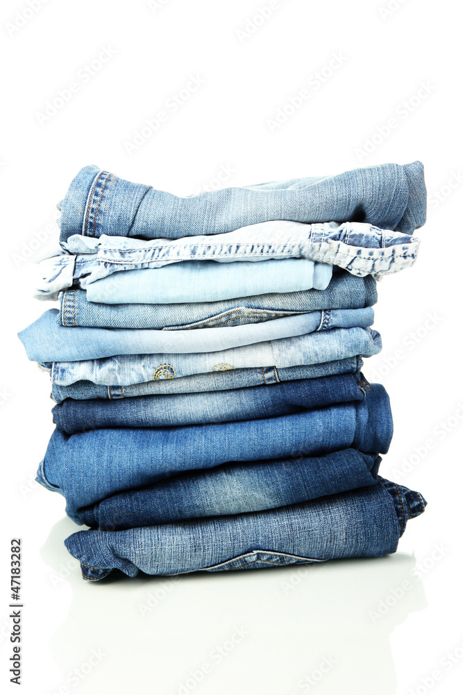 Lot of different blue jeans isolated on white Lot of different blue jeans isolated on white
