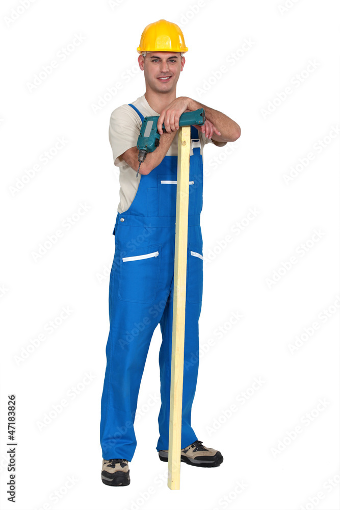 Workman with a cordless drill Workman with a cordless drill