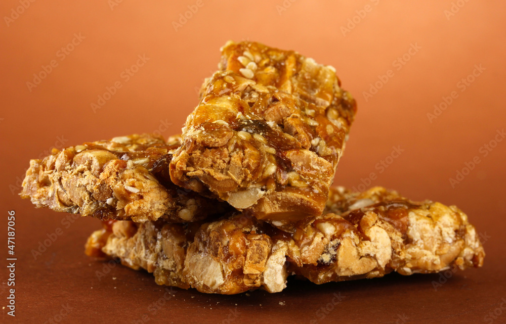 tasty sweets (kozinaki), on brown background tasty sweets (kozinaki), on brown background