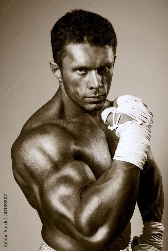 Fighter holds hands clenched in fists before himself. Fighter holds hands clenched in fists before himself.