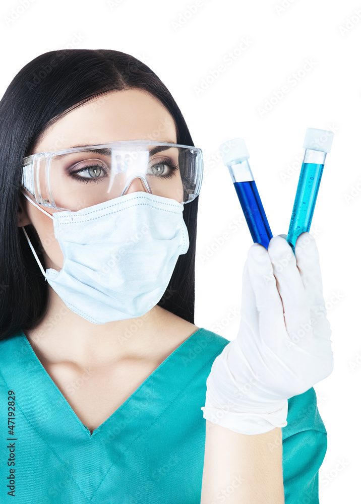 scientist holding tubes with blue liquid scientist holding tubes with blue liquid