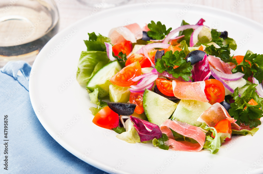 fresh vegetable salad with prosciutto ham