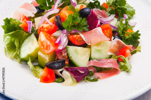 fresh vegetable salad with prosciutto ham