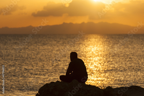 Silhouette of a person against sunset © Paul Vinten