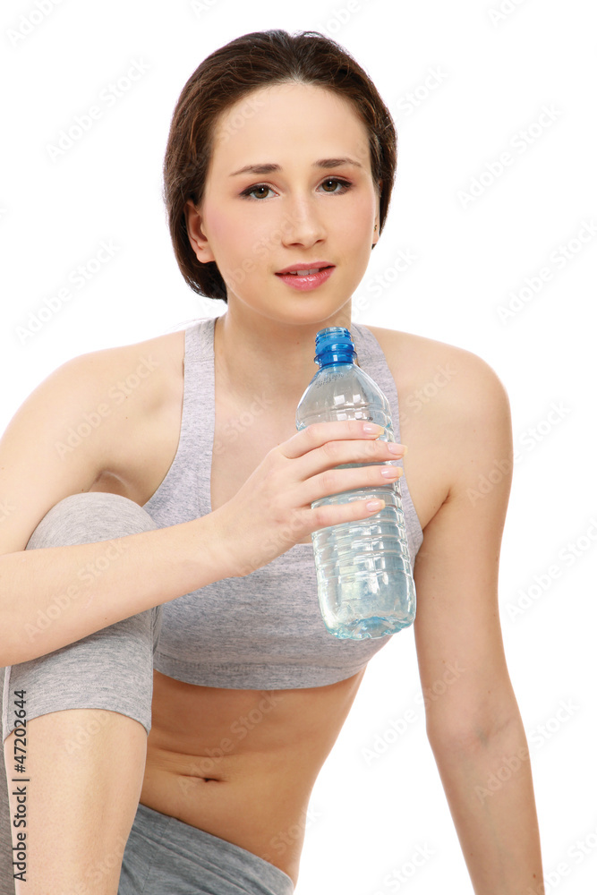 A sportive young girl sitting on the floor A sportive young girl sitting on the floor