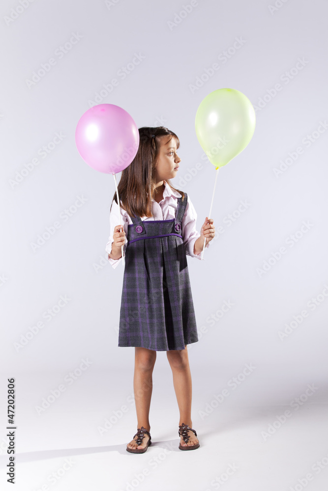 Little girl holding color ballons Little girl holding color ballons