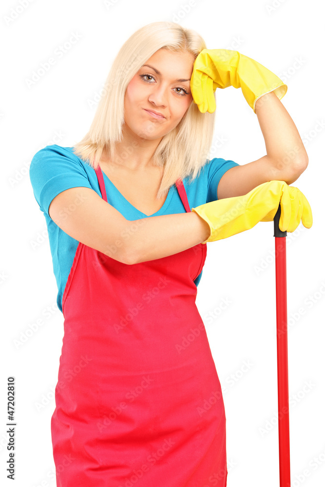 Exhausted female cleaner posing with brush Exhausted female cleaner posing with brush
