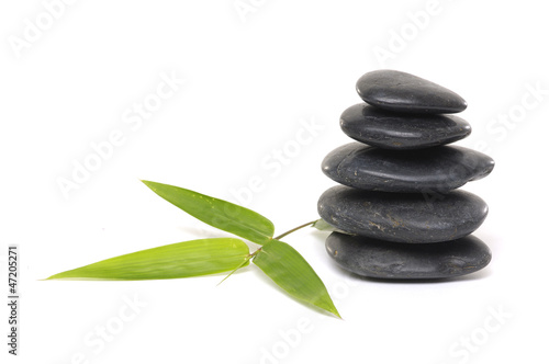 Spa stones stacked in perfect balance with bamboo