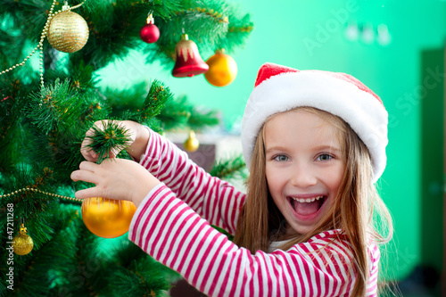 little girl in the santa claus hat