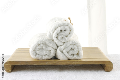 Three rolled white towel