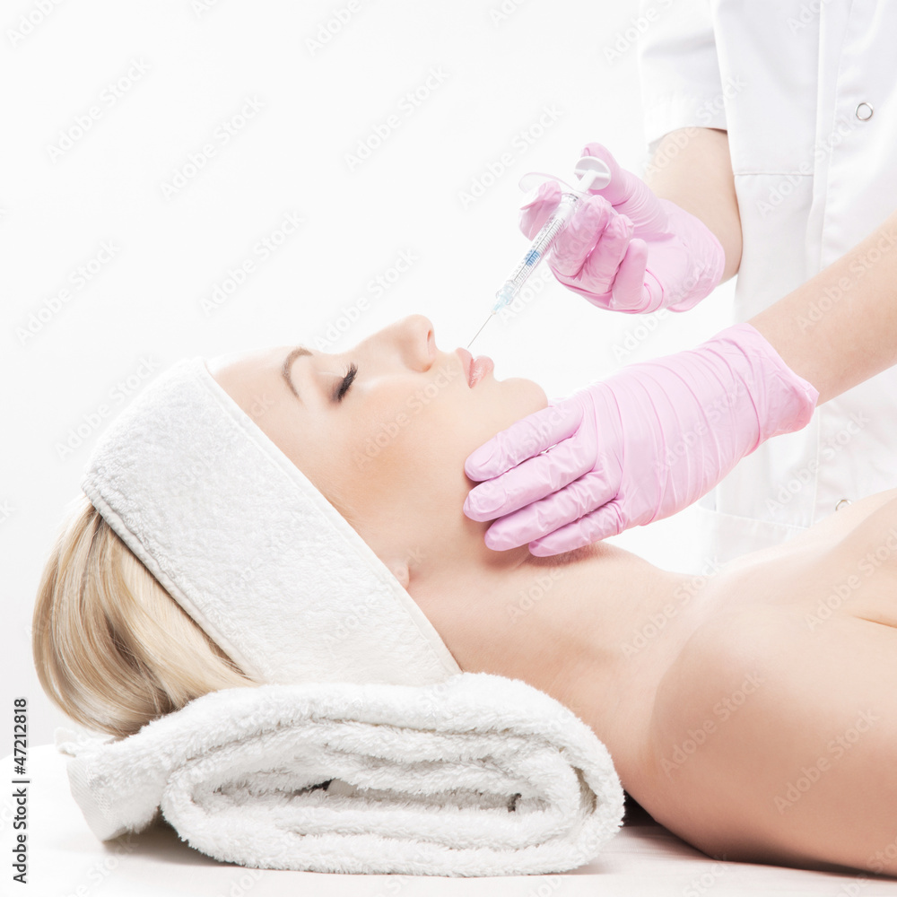Naklejka premium Portrait of a young woman on a botox injection procedure