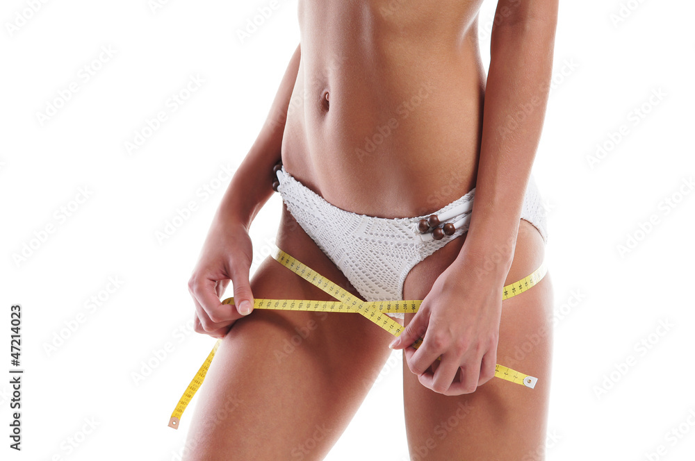 Sexy body of a young woman measuring her hips with a tape Stock Photo |  Adobe Stock