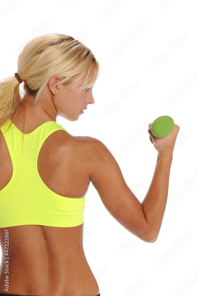 Young blond woman working out wit a bumbell Young blond woman working out wit a bumbell