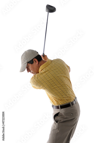 Middle age golfer swinging a golf club