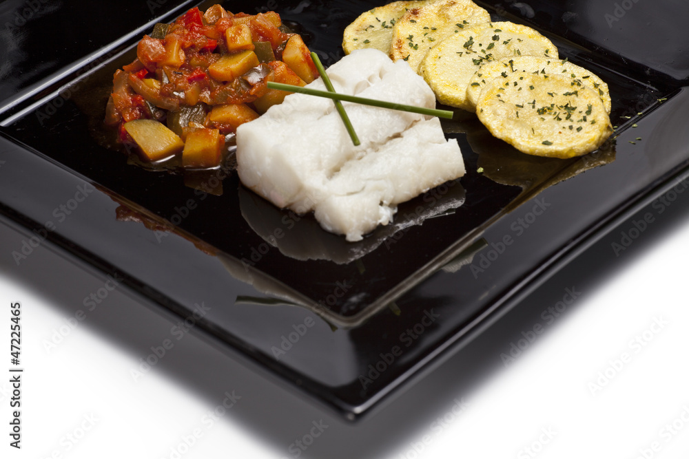 Fish dish with chips and vegetables Fish dish with chips and vegetables