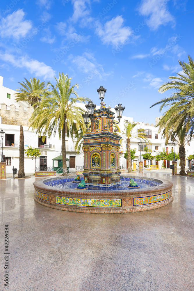 Fototapeta premium Beautiful and multi-colored fountain in a square, multi-tiered