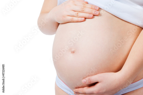 Pregnant belly, isolated on white