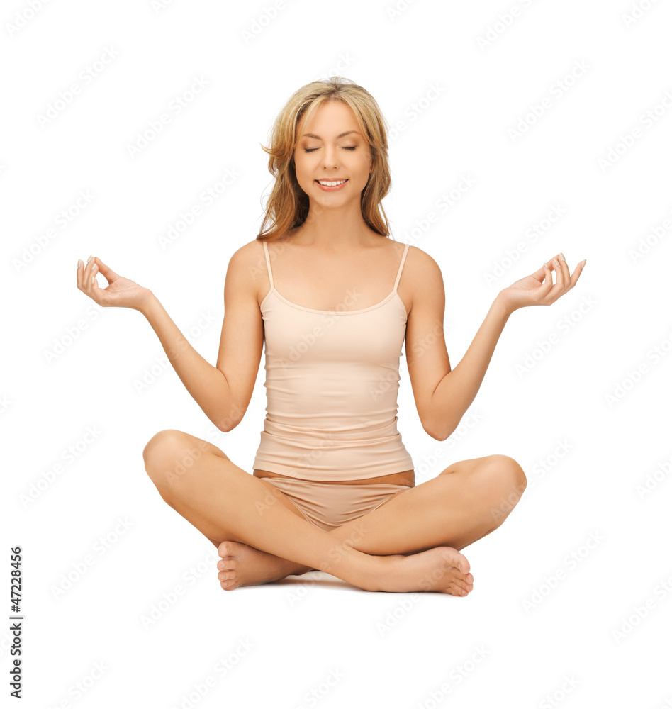 woman practicing yoga lotus pose woman practicing yoga lotus pose