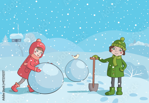 Children making snowman in the morning