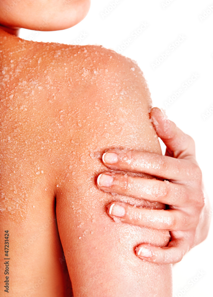 Fototapeta premium Beautiful young woman scrubbing body.