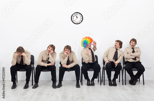 Stressed people waiting for a job interview photo