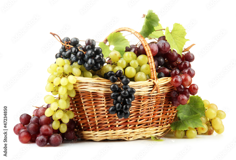 assortment of ripe sweet grapes in basket, isolated on white. assortment of ripe sweet grapes in basket, isolated on white.