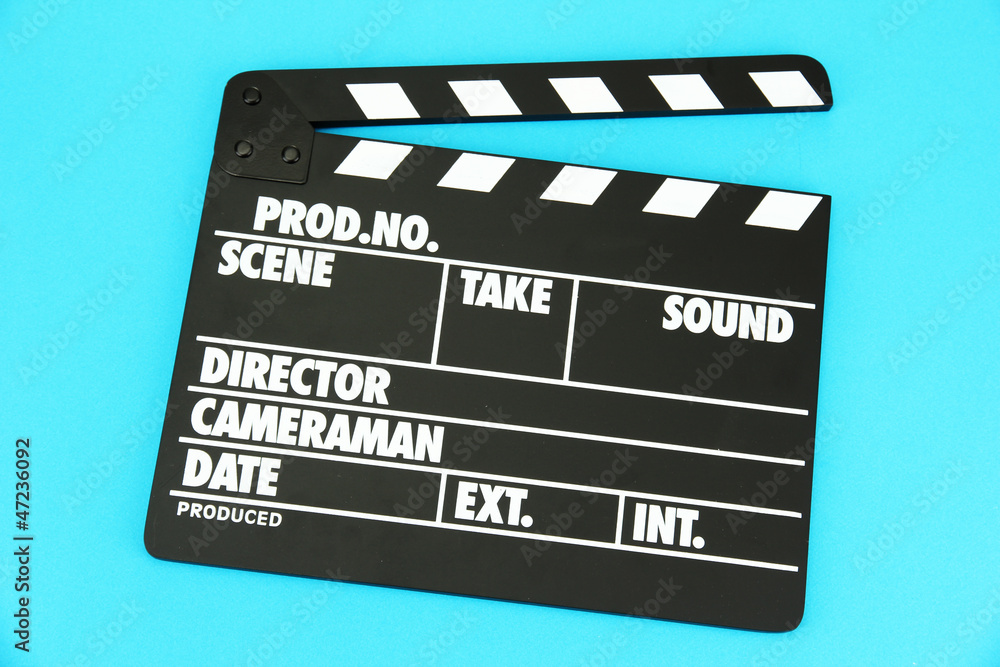 Fototapeta premium Movie production clapper board on color background