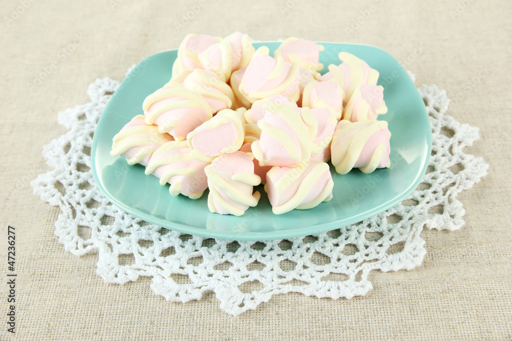 Marshmallows on color plate on light background Marshmallows on color plate on light background
