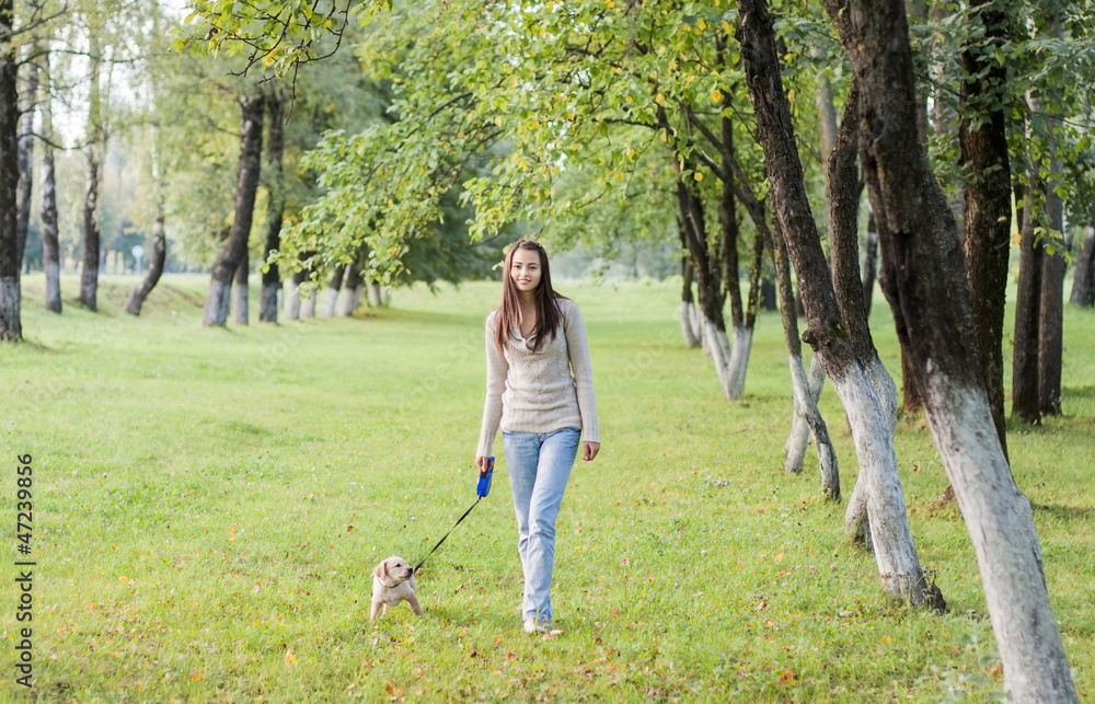 Girl with her dog resting outdoors Girl with her dog resting outdoors