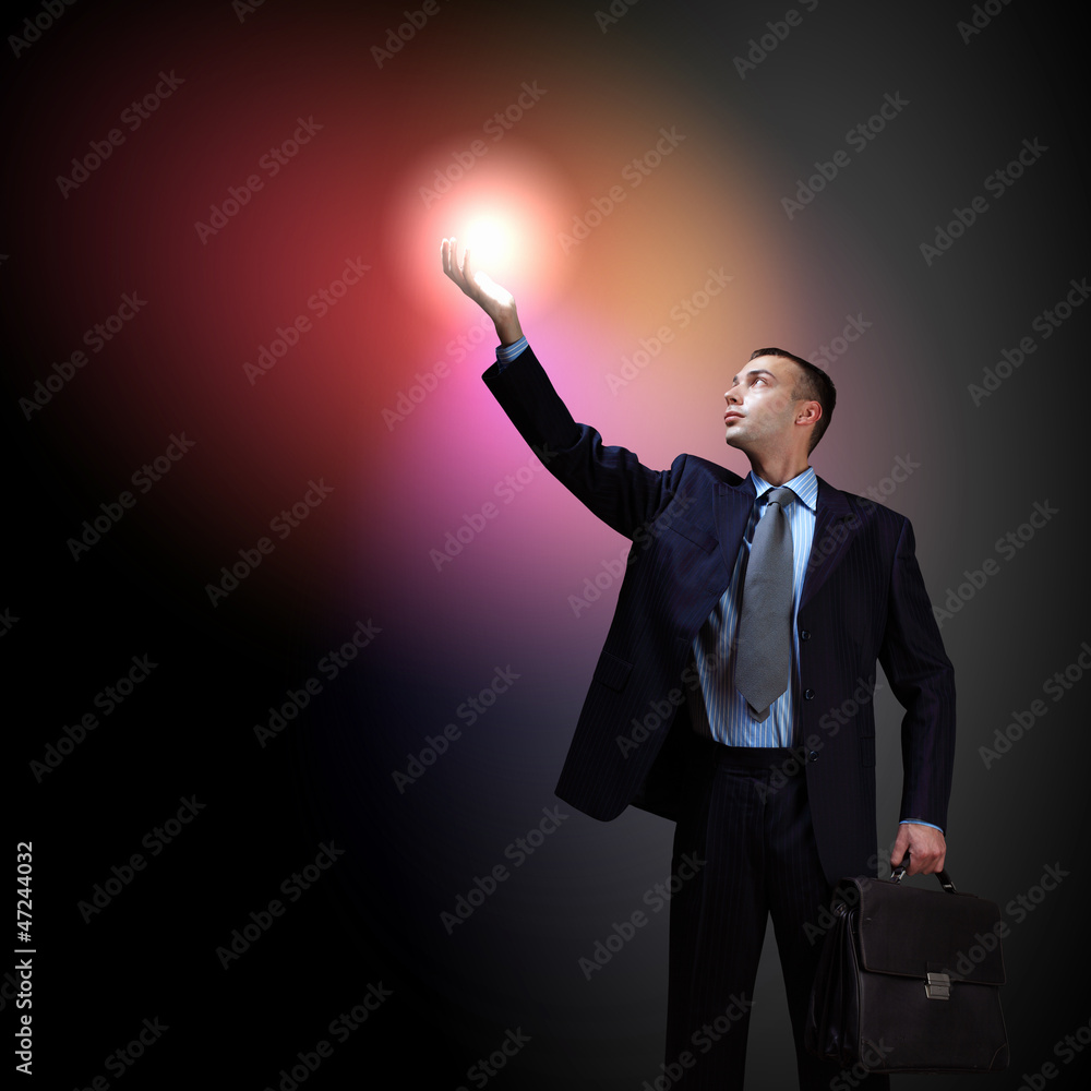 Businessman with light shining Businessman with light shining