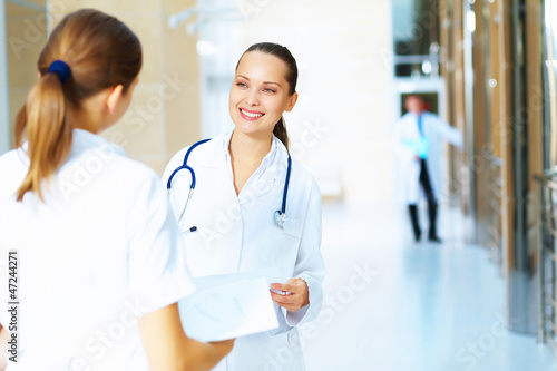 Portrait of two friendly female doctors