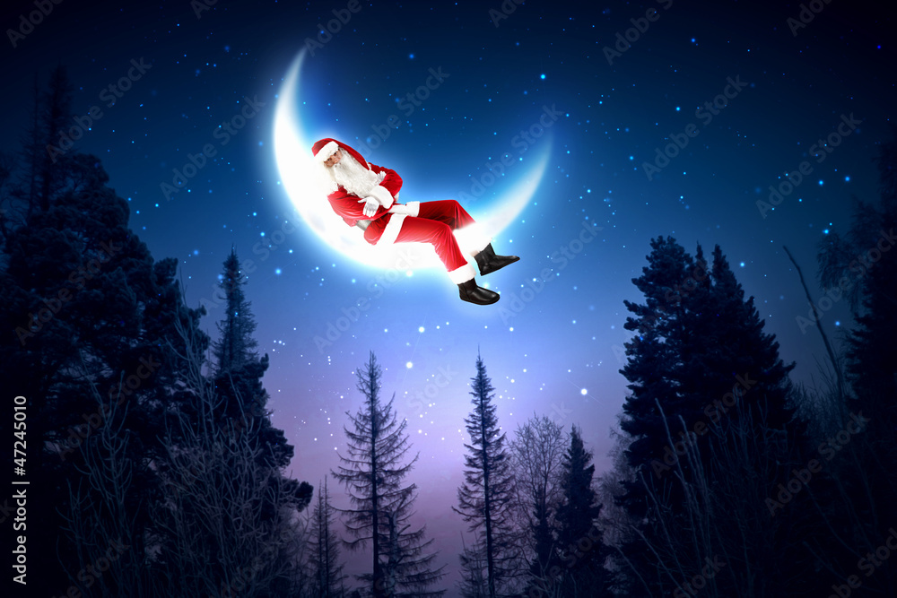 photo of santa claus sitting on the moon photo of santa claus sitting on the moon