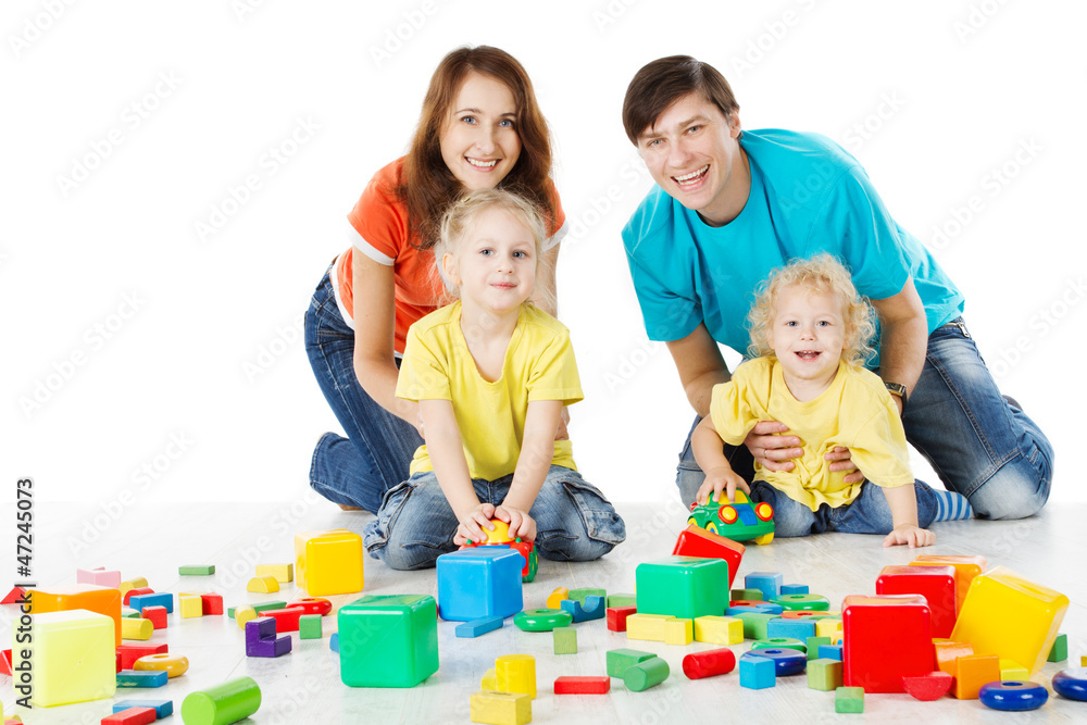 Happy family. Parents with three kids playing blocks over white Happy family. Parents with three kids playing blocks over white
