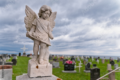 Angel under storm clouds