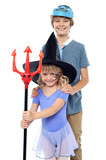 Boy and girl wearing halloween costume