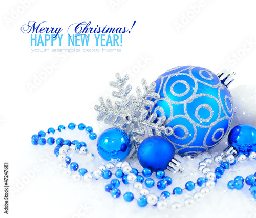 Blue and silver christmas decoration baubles on white
