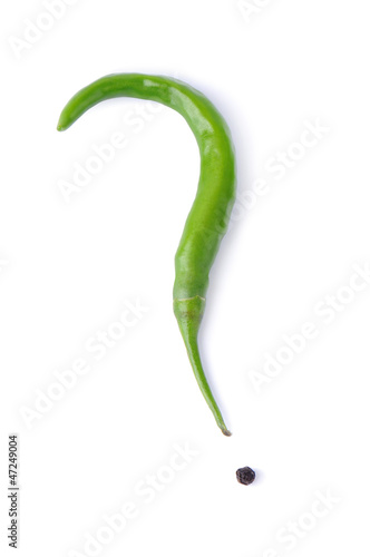 question mark made of green  chili peppers on white background