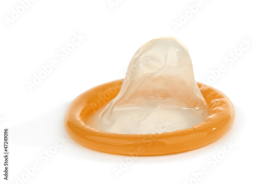 Yellow condom isolated on white