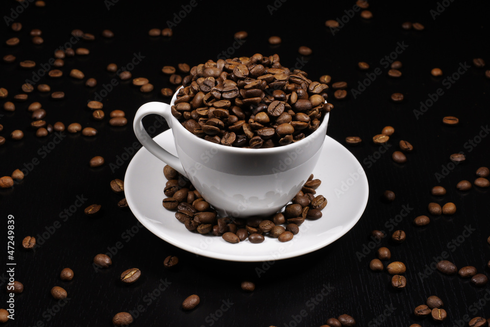 Cup with coffee beans Cup with coffee beans