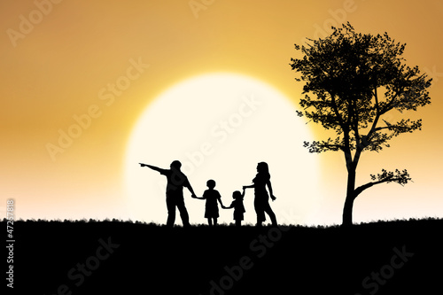 Family silhouette of on sunset and tree background