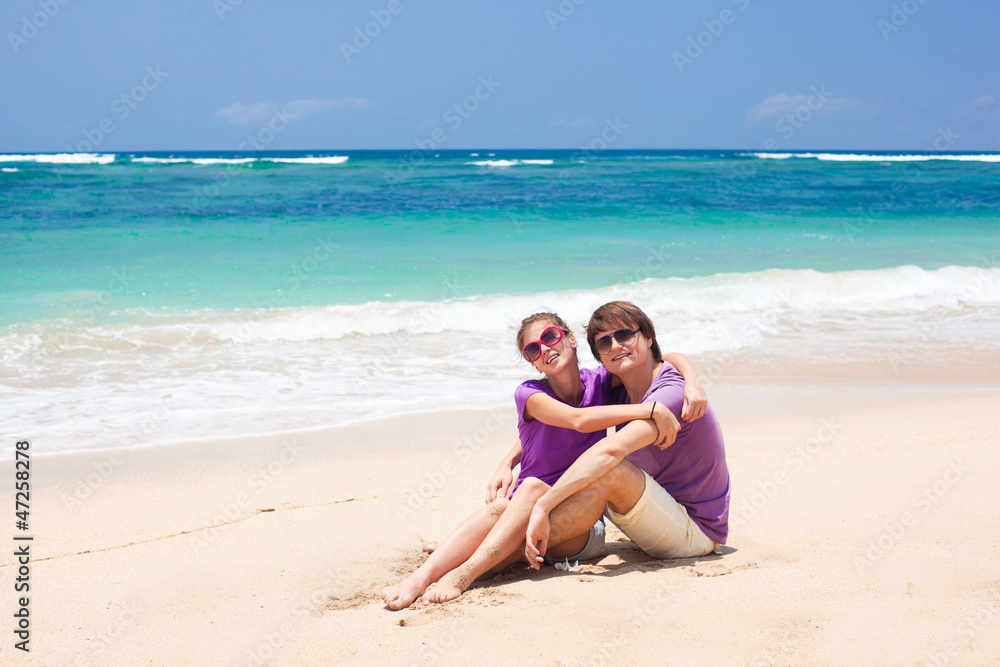 young beautiful couple on tropical bali beach.honeymoon
