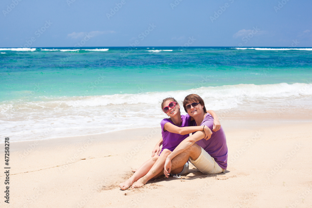 young beautiful couple on tropical bali beach.honeymoon young beautiful couple on tropical bali beach.honeymoon