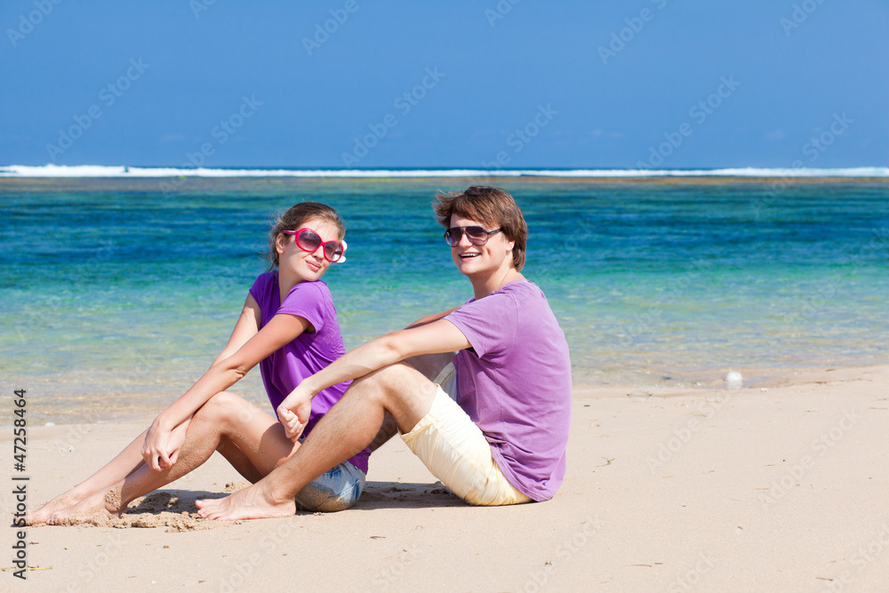 young beautiful couple on tropical bali beach.honeymoon young beautiful couple on tropical bali beach.honeymoon