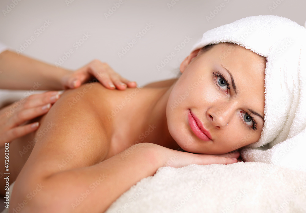 Closeup of an attractive young woman receiving massage Closeup of an attractive young woman receiving massage