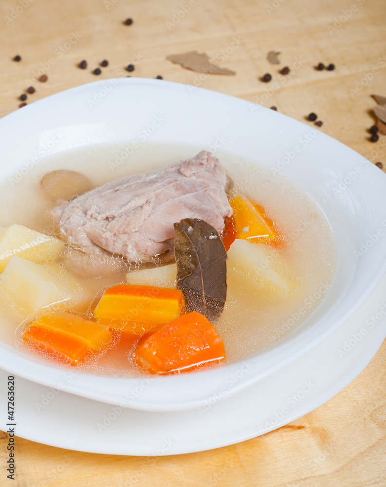 plain chicken soup with vegetables on it plain chicken soup with vegetables on it