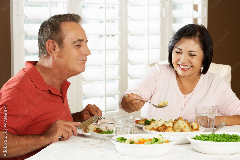 Senior Couple Enjoying Meal At Home