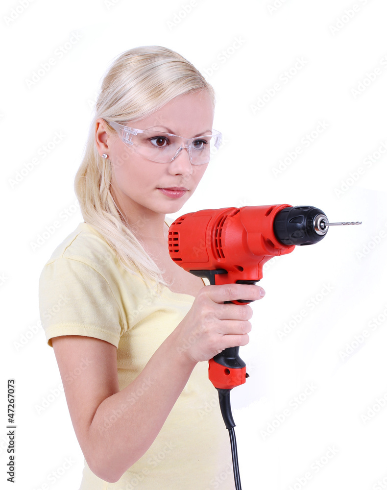 blonde girl with goggles and drill, isolated on white blonde girl with goggles and drill, isolated on white