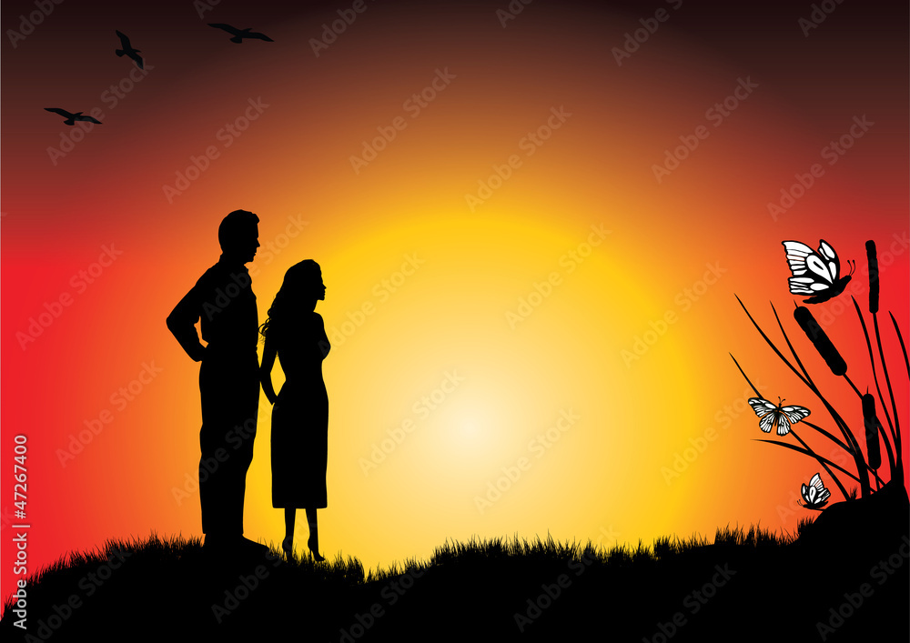 A young couple in the sunset