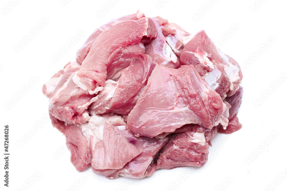 Pieces of raw meat on a white background