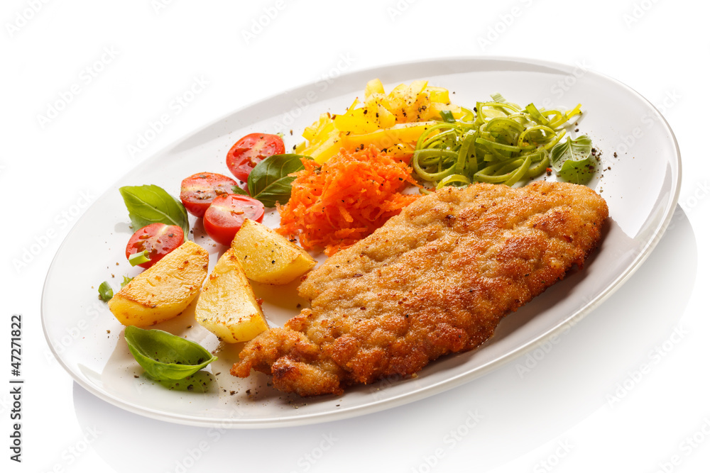 Pork chop, baked potatoes and vegetable salad